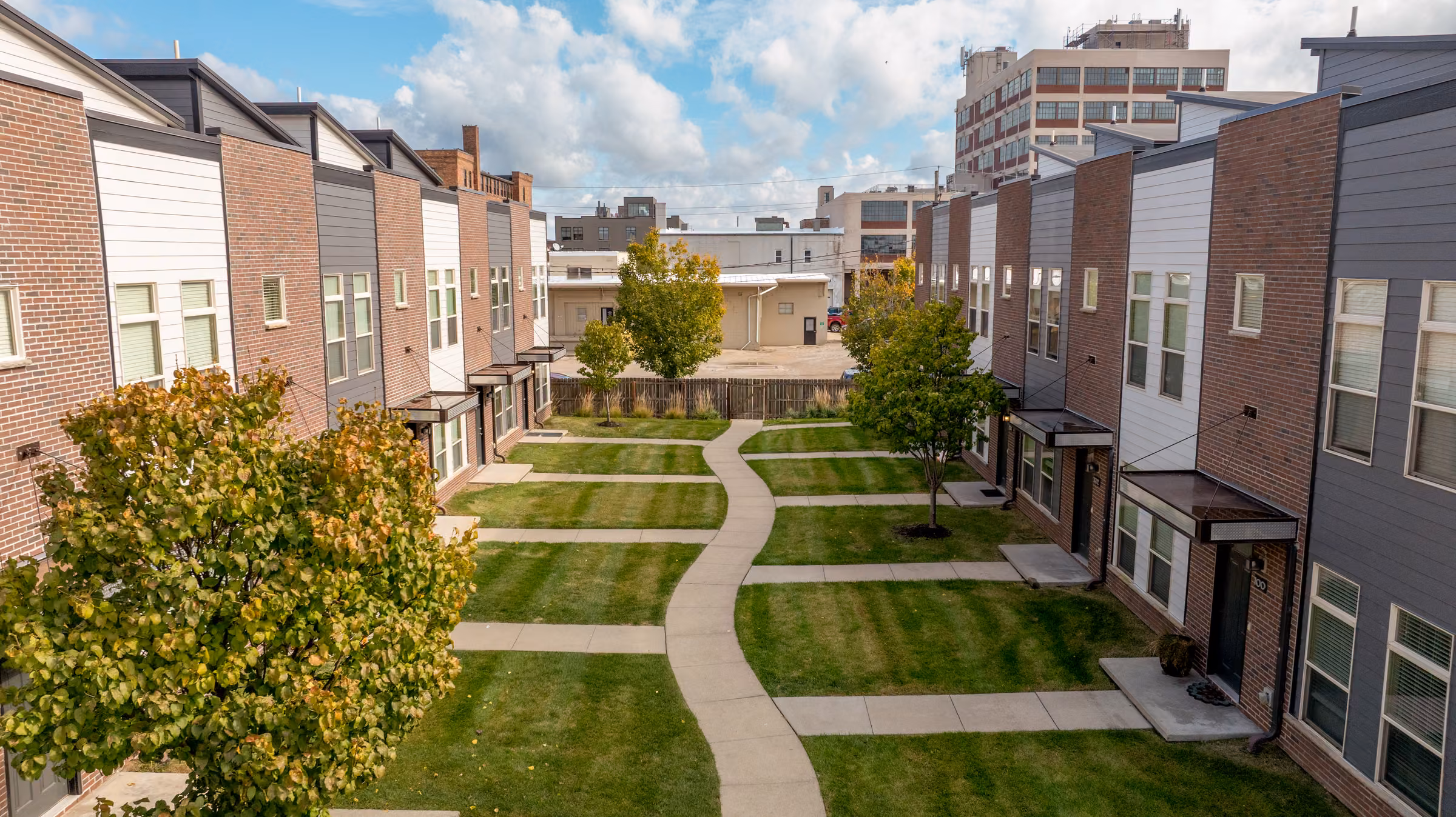 Landscaped courtyard between 7th Street Brownstones residences